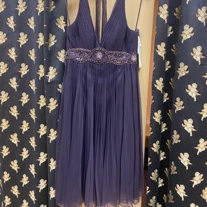Wow! Eggplant halter with beaded empire waistline.
